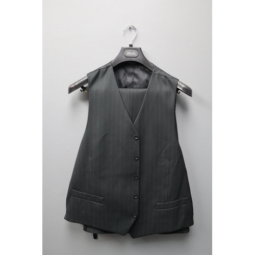 731 - A Black and Grey Pinstriped Milan Collection Three Piece Suit, In Suit Carrier. Jacket is Size 48R, ... 