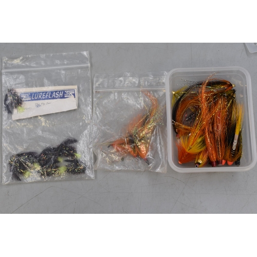 383 - A Selection of Fishing Accessories. Includes Flies, Rubber Tail Spinners and Other