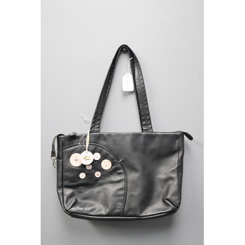 409 - A Black Leather Radley Handbag With Button Pattern Inner Lining