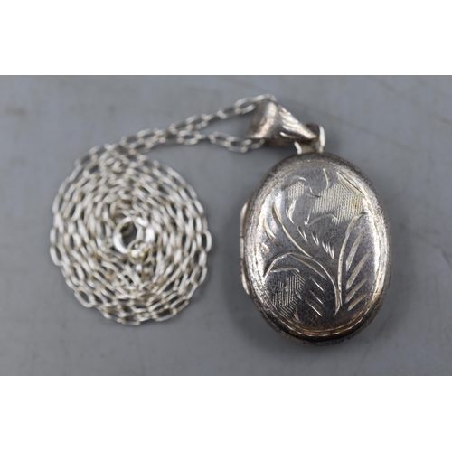 54 - Small Silver 925 Oval Locket Pendant on Silver Chain. Approx. 2cm