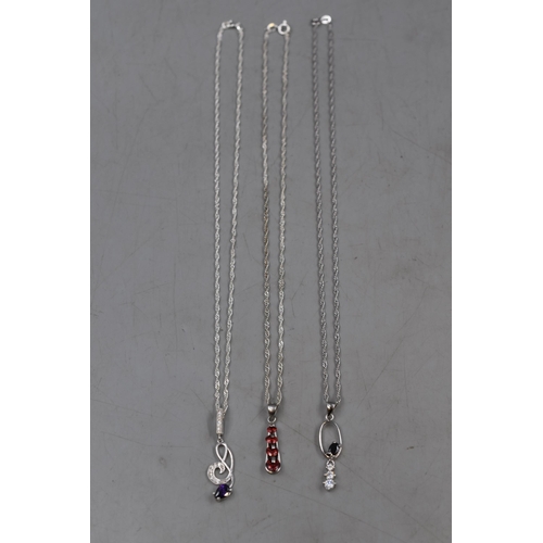 49 - Three Silver 925 Necklaces on Silver Chains. Includes different designs each with Coloured Stones