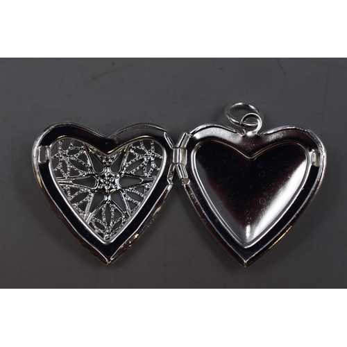 61 - A 925. Silver Heart Pendant and 30