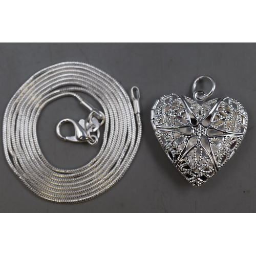 61 - A 925. Silver Heart Pendant and 30