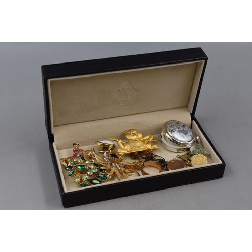 100 - A Mixed Selection of Jewellery To Include Sphinx Brooch, 9ct Gold Plated Locket and More