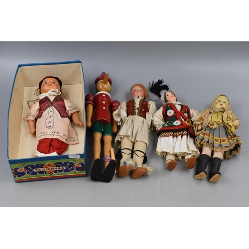 556 - A Selection of Four Vintage Dolls, With Wooden Pinocchio Doll (Has Changeable Nose).