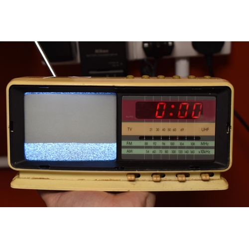 687 - A Questar TV905CR Radio, Alarm Clock and B&W TV (Powers on When Tested), With A Murphy Portable ... 