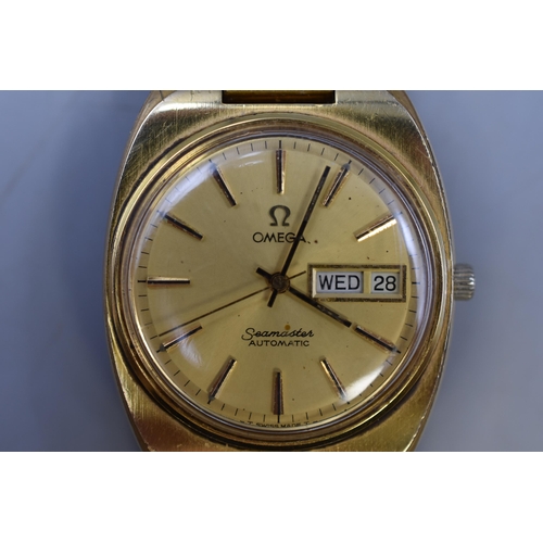 34 - Vintage Omega Seamaster Gold Plated Automatic Day/Date Watch. Seamaster Logo at back. Ticking at tim... 