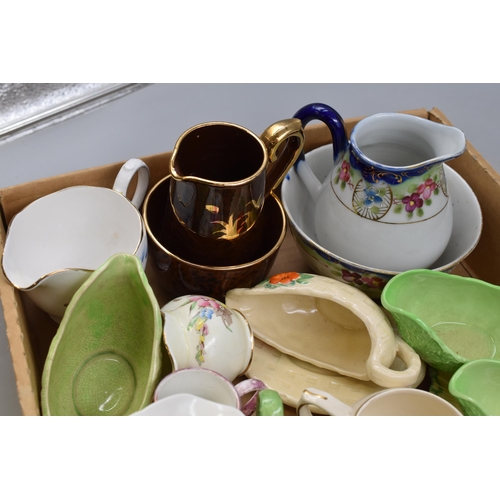 767 - A Selection of Milk Jugs and Sugar Bowls. Includes Arthur Wood, Colclough, Gibsons, Ringtons, And Mo... 