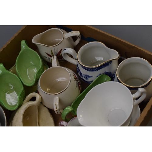 767 - A Selection of Milk Jugs and Sugar Bowls. Includes Arthur Wood, Colclough, Gibsons, Ringtons, And Mo... 