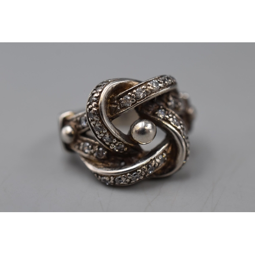 4 - A 925. Silver Clear Stoned Knot Ring, Marked 'THL' On The Inside. Size Q