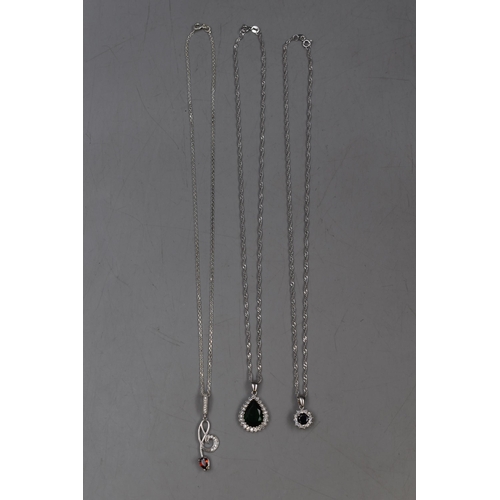 68 - Three Silver 925 Pendant Necklaces, includes Green Stoned Tear Drop, Red Stone with Musical Note and... 