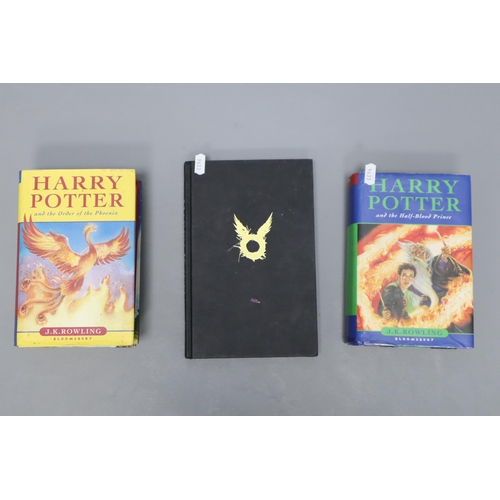 730 - A Selection of Three Harry Potter Books, With Three Hogwarts Houses Framed and Glazed Word Arts. Inc... 