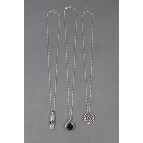 37 - Selection of Three Silver 925 Pendant Necklaces. Includes Green Stone Design, Swirl Design and Colou... 