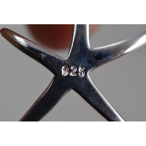 38 - A 925. Silver Starfish Pendant on 925. Silver Chain