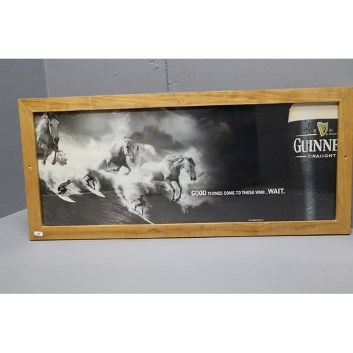 391 - Two Guinness Promotional Posters Mounted in Ash Wooden frames (Largest 35