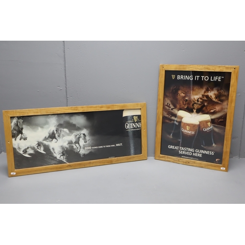 391 - Two Guinness Promotional Posters Mounted in Ash Wooden frames (Largest 35