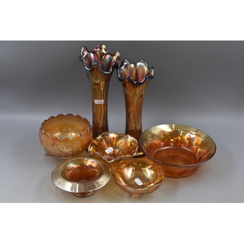 244 - Seven Pieces of Carnival Glass. Includes Two Vases, Footed Bowl, And More