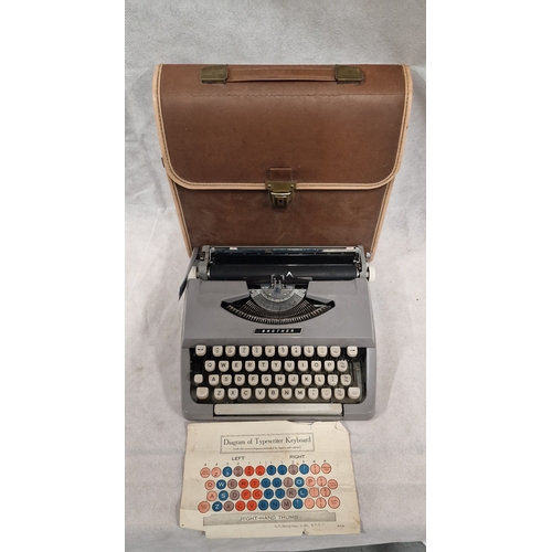 455 - Vintage Ultra Portable Brother Typewriter With Case and Keyboard Diagram.