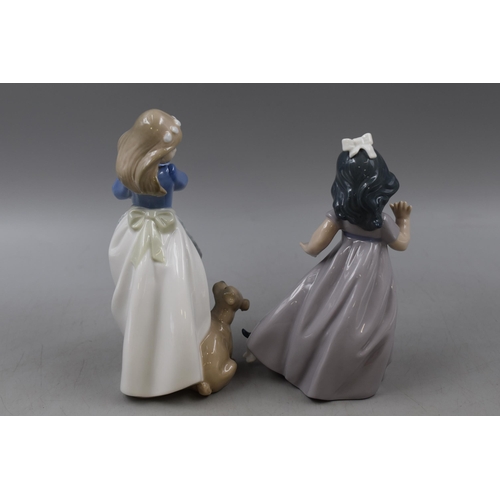 293 - Two Nao by Lladro Figures of Girls with Playful Puppies (Approx. 7.5” x 6.5”)