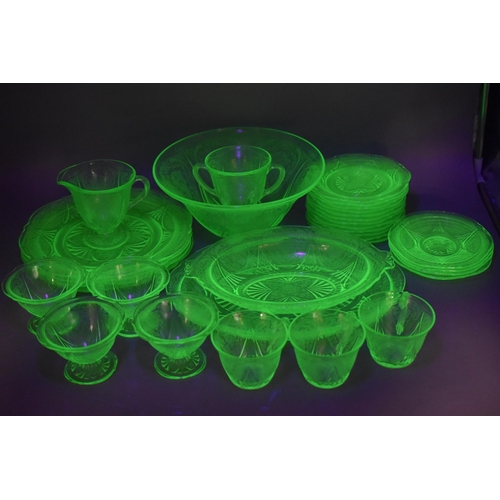 303 - Twenty-Seven Pieces of Uranium Glassware. Includes Large Bowl, Sundae Bowls, Serving Dish, Side Plat... 