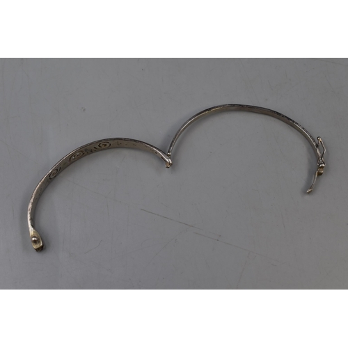 18 - A Sterling Silver Spiral Bangle