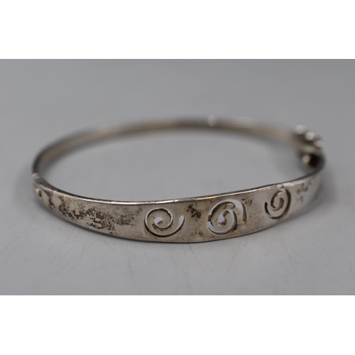 18 - A Sterling Silver Spiral Bangle