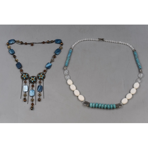 109 - Two Designer Necklaces. Includes Turquoise And Moonstone Stoned, And Other