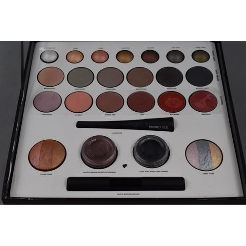 114 - A Front Cover Cosmetics Make-Up Set. Includes Eye Shadow, Lip Gloss, Mascara, Shadowline, And More