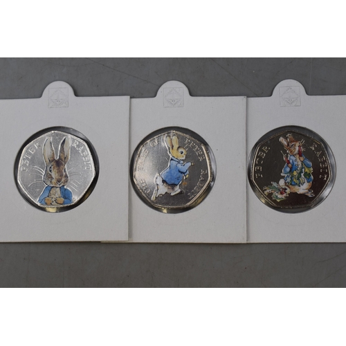 139 - Three The World of Peter Rabbit 150 Year 50p Coins Complete with Display Cases