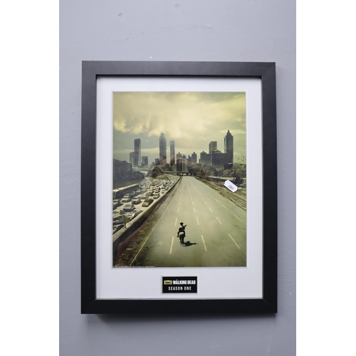 663 - Two Framed and Glazed Pieces of The Walking Dead Wall Art. Includes Season One Cinematic Screenshot,... 