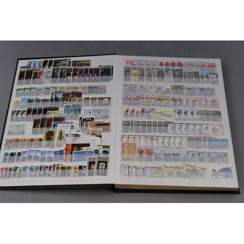 512 - A Stock Book Containing a Large Collection of New Zealand Stamps