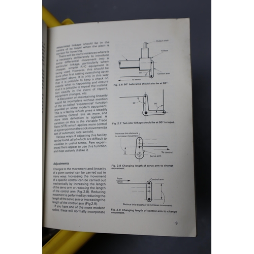 799 - A Selection of Remote Controlled Vehicle Parts, With Remote Controlled Helicopter Handbook.