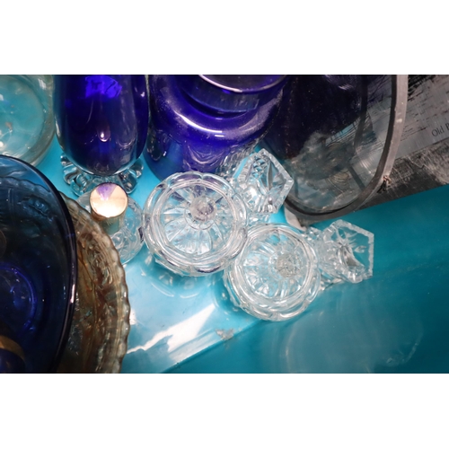 844 - Mixed lot of glassware to include 2 decanters, 3 lidded trinket boxes, blue vae and jar and much mor... 