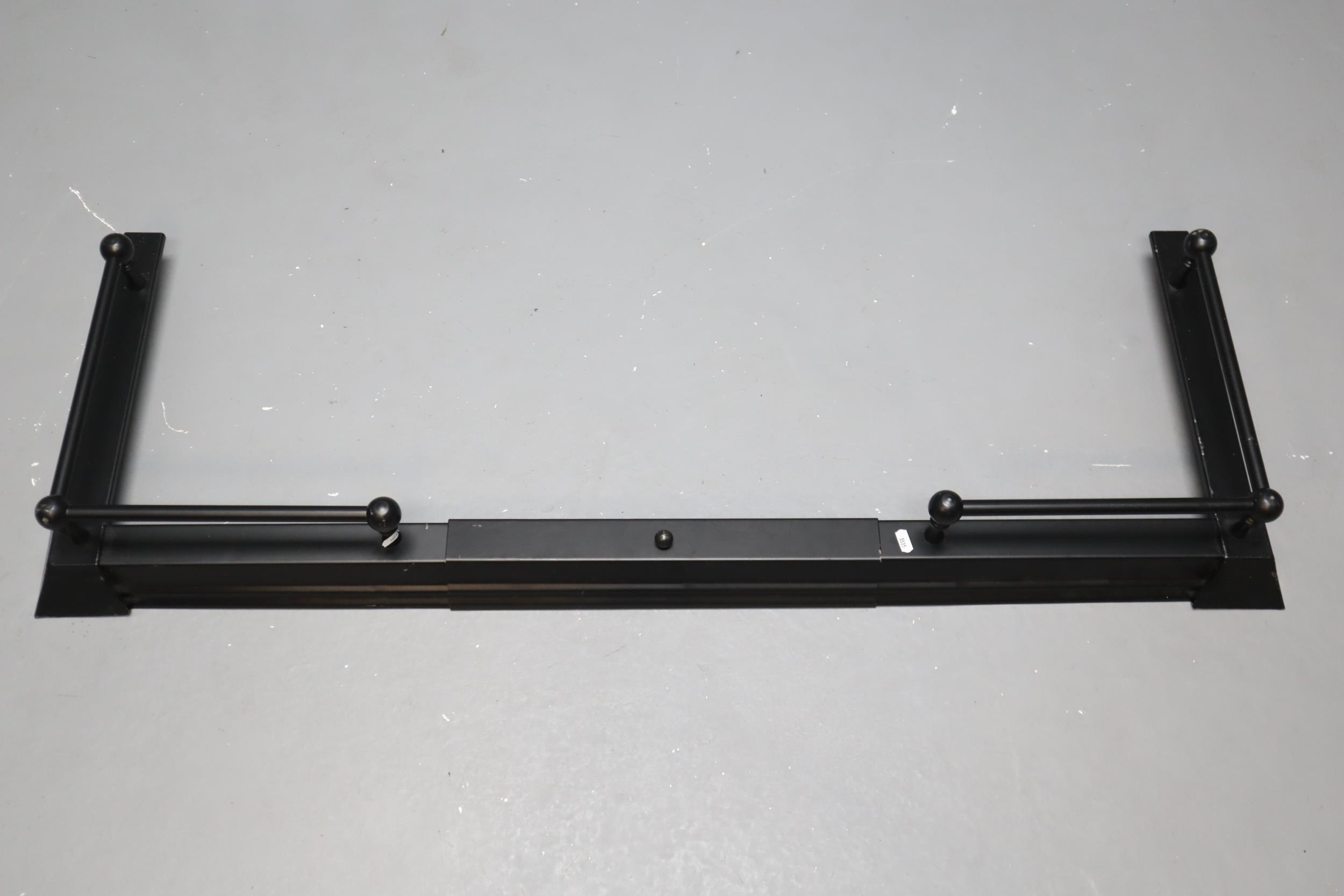 A Black Metal Adjustable Fire Fender