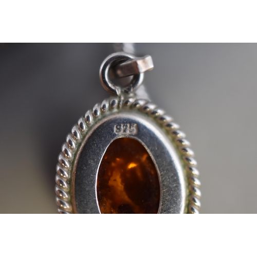 30 - A 925. Silver Amber Stoned Pendant on 925. Silver Chain