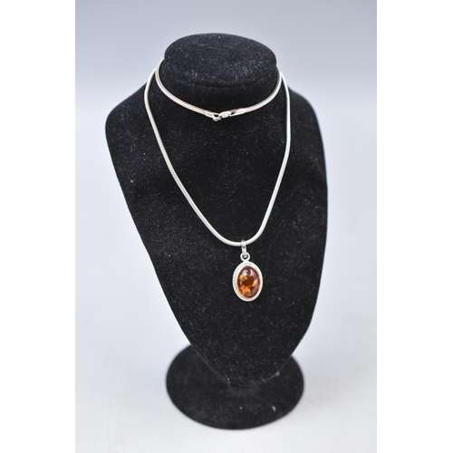 30 - A 925. Silver Amber Stoned Pendant on 925. Silver Chain