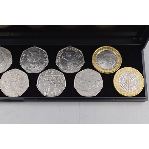 106 - Twelve Collectors 50p Coins and two £2 Coins including Paddington Bear, Sherlock Holmes and Mo... 