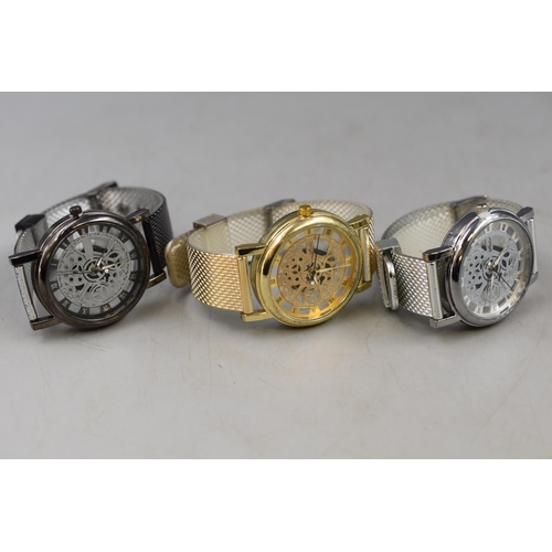 101 - Three Quartz Skeleton Watches. Includes One Silver Tone, One Gold Tone and Other