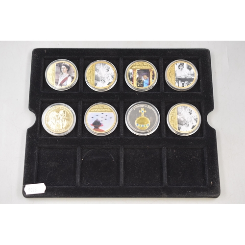 153 - Eight Elizabeth II Gold Plated Pictorial Commemorative Coins Complete with capsules