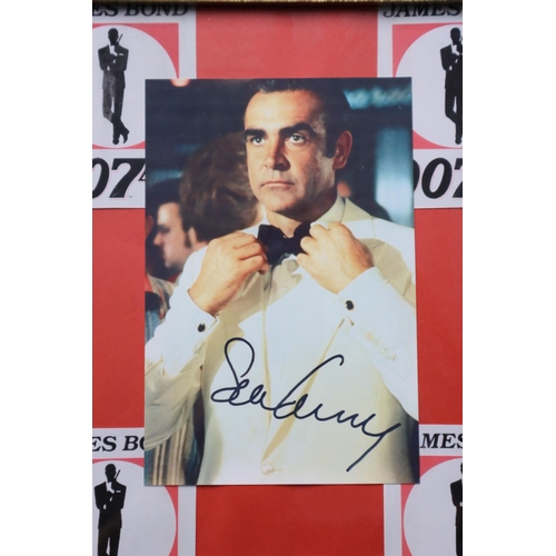 383 - Framed and Glazed Collection of James Bond Printed Photographs with printed signatures 20