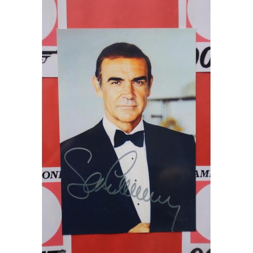 383 - Framed and Glazed Collection of James Bond Printed Photographs with printed signatures 20