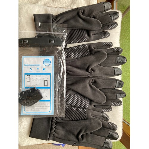 415 - Two pairs of anti slip, screen touch cycling gloves, size small and a waterproof mobile phone case/c... 