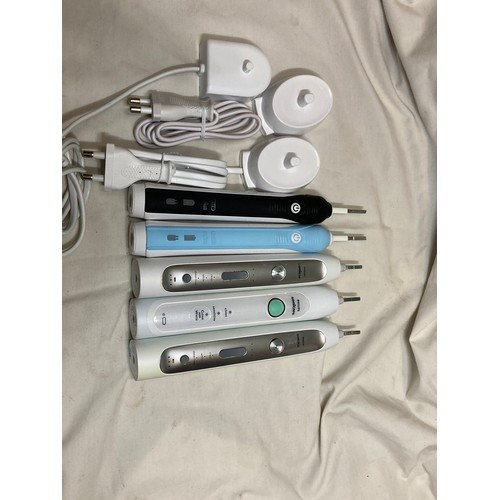 418 - Five electric toothbrushes, two Braun Oral B and three Philips Sonic, plus 3 chargers, all untested