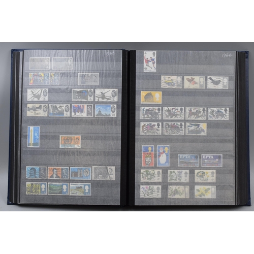 443 - A WH Smith Stamp Stock Book Containing GB Used and Mint Stamps From 1902-1970. Includes Sets, High V... 