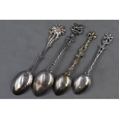 10 - Four Italian Decorative Teaspoons including Silver