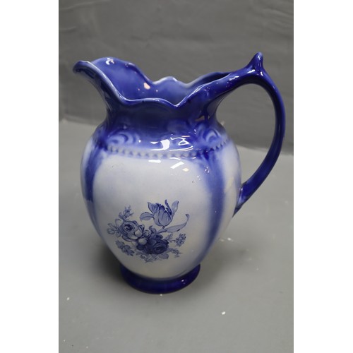 399 - Three Blue and White Pottery items to include Staffordshire Jugs and unmarked Floral Vase