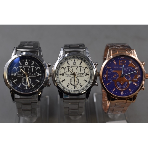 70 - Three Quartz Chronograph Style Gents Watches, On Stands. Includes Modiya, and Fulaida