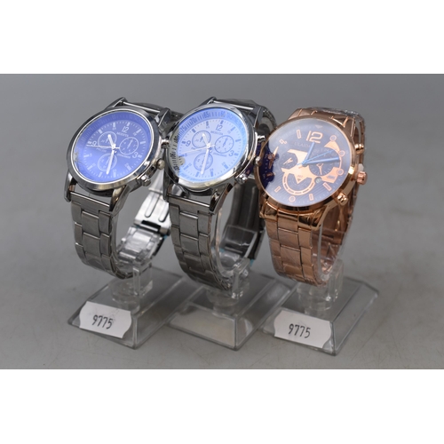 70 - Three Quartz Chronograph Style Gents Watches, On Stands. Includes Modiya, and Fulaida