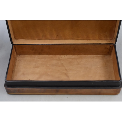 219 - Four villager cigars in a leather covered box with a gold crest, measures 9