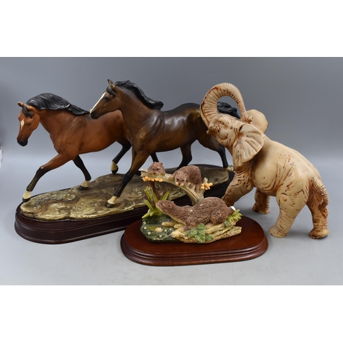 671 - Large Horse Figurine Mounted on Wooden Plinth (18